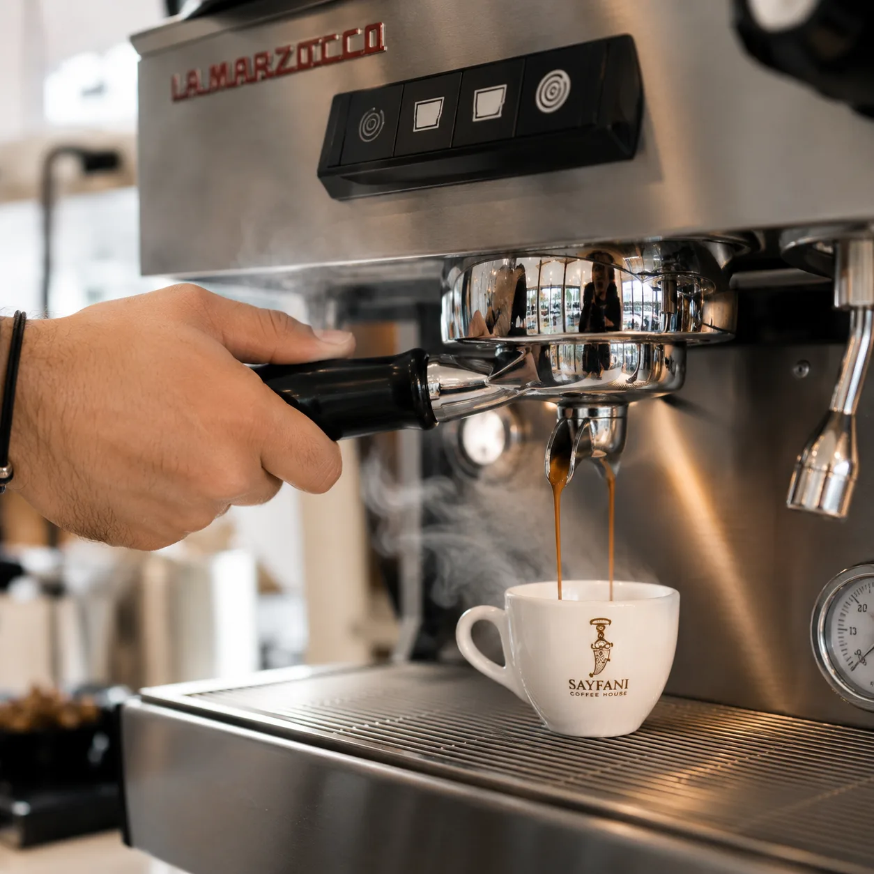 Barista pulling a fresh espresso shot at Sayfani Coffee House
